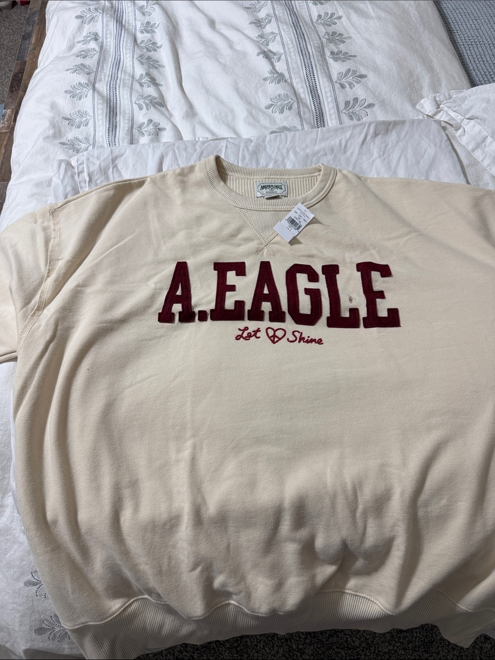 American Eagle Cream Sweatshirt with Burgundy Appliqué
